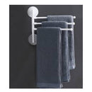 Colgador giratorio de pared en color blanco con toallas gris oscuro para optimizar el espacio en el hogar