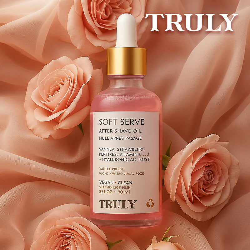 Botella rosa Soft Serve aceite after shave para hombre con cuentagotas y aroma floral presentada entre rosas
